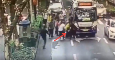 Video hàng chục người hợp sức nâng xe buýt giải cứu cô gái bị cuốn vào gầm