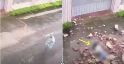 Video: Đang đi dưới mưa cô gái bị tường đổ sập, đè lên người