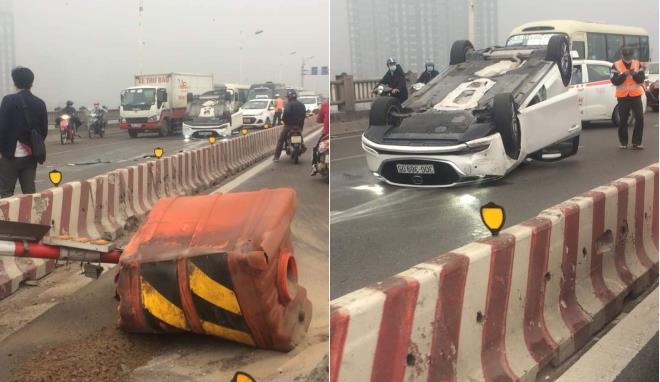 Hà Nội: Nữ tài xế tông vào dải phân cách, ô tô lật ngửa trên cầu Vĩnh Tuy - 1