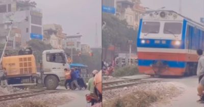 Clip: Người dân ‘giải cứu’ tài xế mắc kẹt trên đường ray trong gang tấc