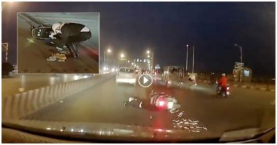 Đi vào khe co giãn trên cầu, người phụ nữ loạng choạng tay lái rồi ngã trước đầu ôtô