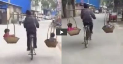Video: Người đàn ông đi xe đạp, gánh 2 đứa trẻ lắc lư trên đường đông phương tiện qua lại