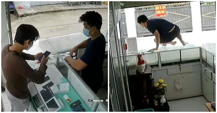 Chủ tiệm điện thoại phi thân qua tủ kính bắt trộm nhưng bất thành (ảnh cắt từ clip).